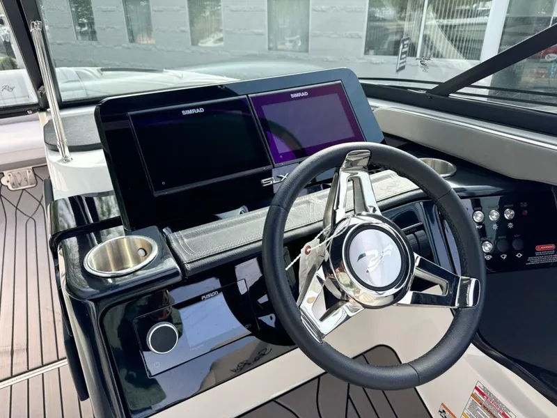 Slide: The Image of 2024 Sea Ray SXS 260 SURF helm with Simrad displays. - 8