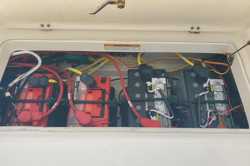 Slide: The Image of Battery compartment of a 2017 Robalo R302 Center Console boat. - 24