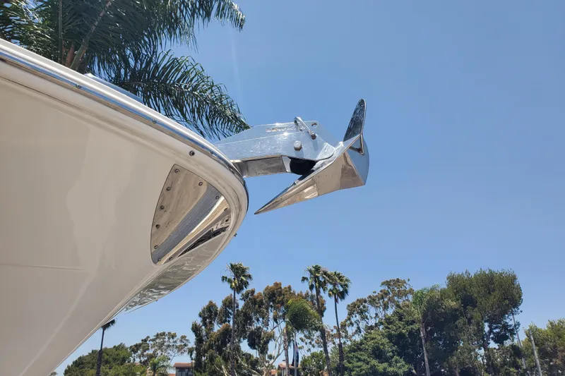 Slide: The Image of 2017 Robalo R302 Center Console boat anchor against clear blue sky. - 4