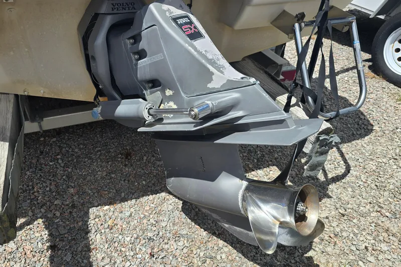 Slide: The Image of 1999 Wellcraft 186 SS/S boat with Volvo Penta outboard motor on gravel surface. - 12