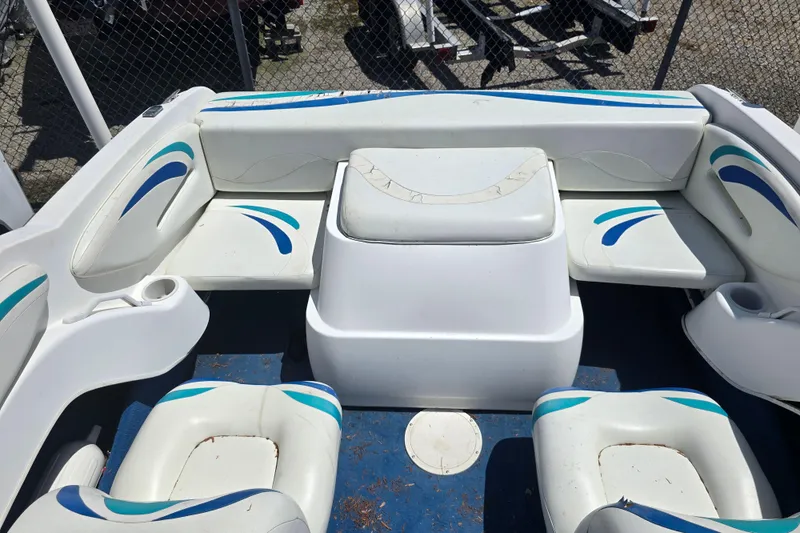 Slide: The Image of Interior seating of a 1999 Wellcraft 186 SS/S boat with white and blue upholstery. - 17