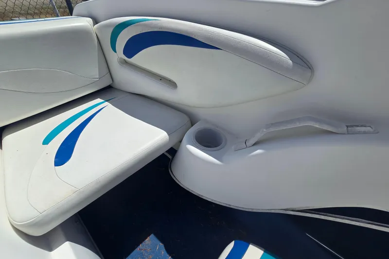 Slide: The Image of Interior seating of a 1999 Wellcraft 186 SS/S boat with blue accents. - 20
