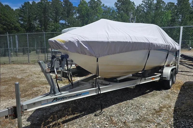 Slide: The Image of Covered 1999 Wellcraft 186 SS/S boat on trailer in fenced outdoor area. - 5