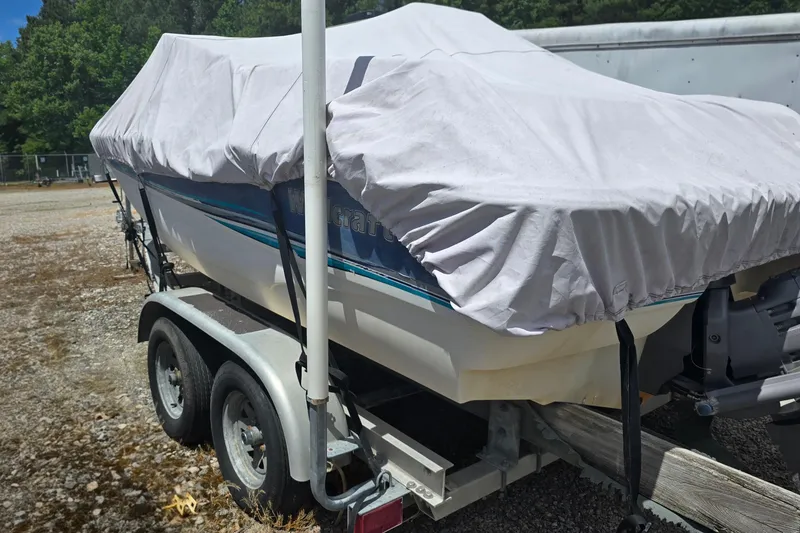 Slide: The Image of Covered 1999 Wellcraft 186 SS/S boat on trailer in outdoor storage. - 6