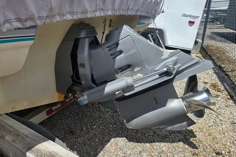 Slide: The Image of 1999 Wellcraft 186 SS/S boat with Volvo Penta outdrive, parked on gravel. - 9