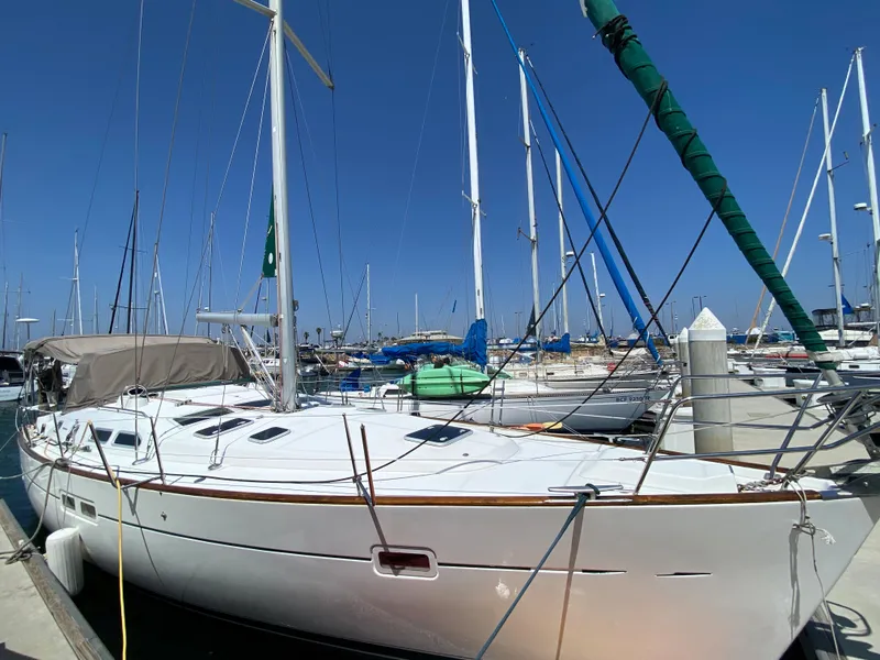 Slide: The Image of 2003 Beneteau 423 sailboat docked at a marina on a sunny day. - 1