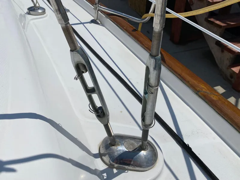 Slide: The Image of Close-up of rigging hardware on a 2003 Beneteau 423 sailboat. - 13