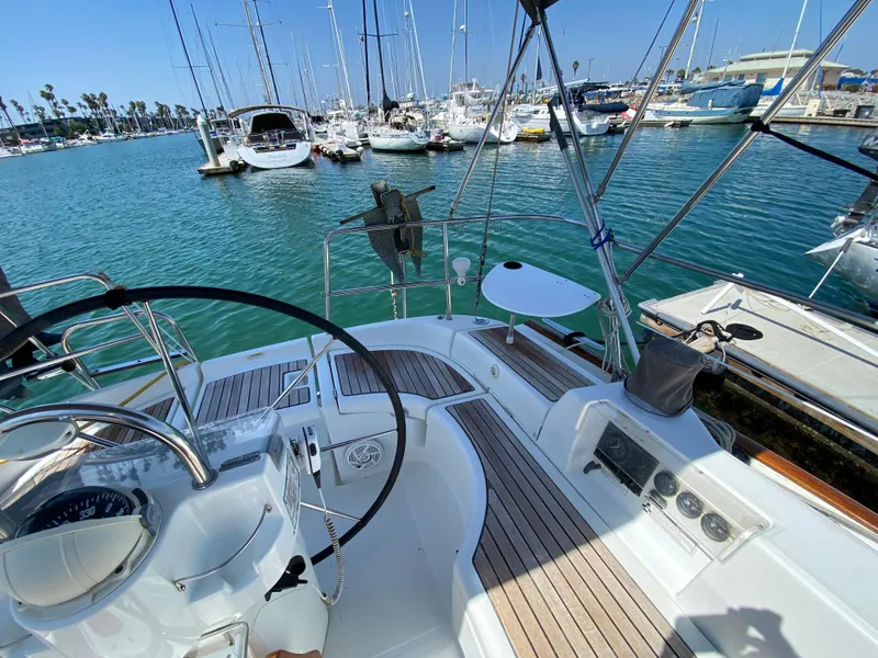 Slide: The Image of Cockpit view of a 2003 Beneteau 423 sailboat docked in a marina. - 20