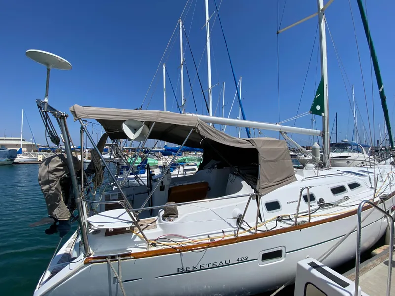 Slide: The Image of 2003 Beneteau 423 sailboat docked at a marina on a sunny day. - 3