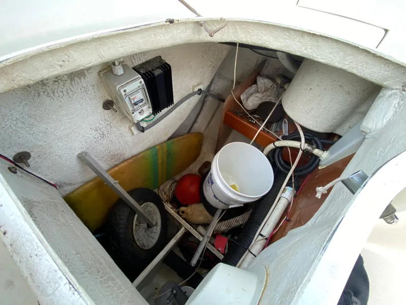 Slide: The Image of Storage compartment of a 2003 Beneteau 423 sailboat with various equipment. - 32