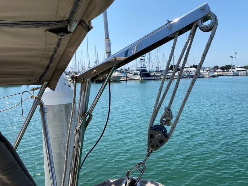 Slide: The Image of Beneteau 423 sailboat, 2003 model, docked at marina with clear blue water. - 36
