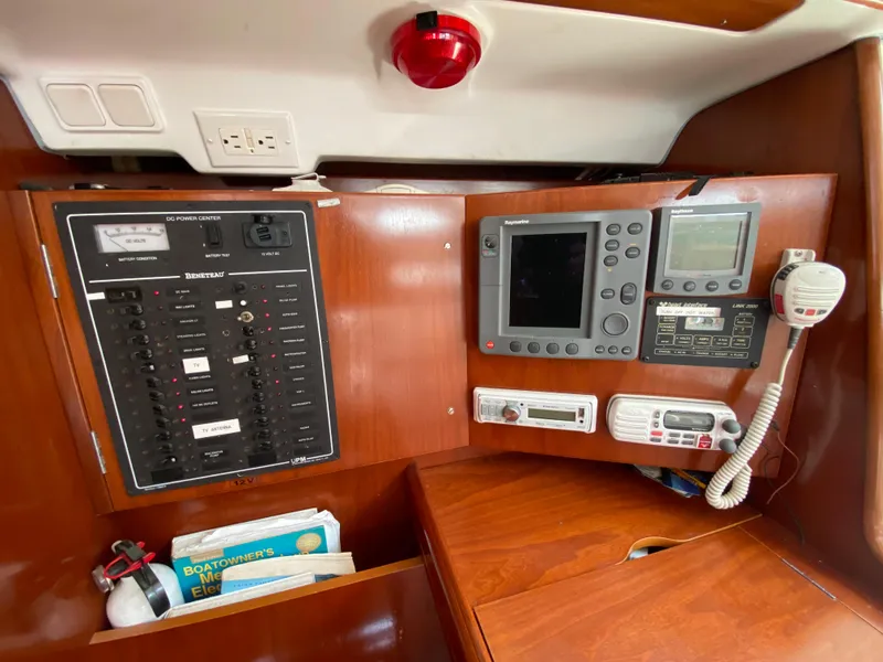 Slide: The Image of Navigation and control panel inside a 2003 Beneteau 423 sailboat cabin. - 46