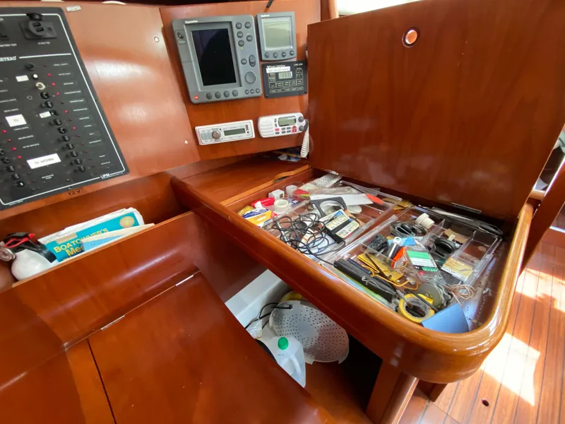 Slide: The Image of Navigation station on a 2003 Beneteau 423 yacht with equipment and organized tools. - 47