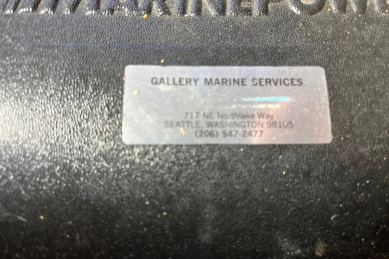 Slide: The Image of Label on 1976 Fiberform 34 boat, showing Gallery Marine Services contact details. - 18