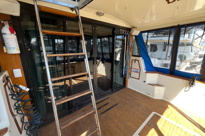 Slide: The Image of 1976 Fiberform 34 boat interior with ladder, sliding doors, and nautical equipment. - 5