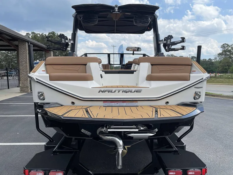 Slide: The Image of Rear view of 2026 Nautique G23 boat in parking lot. - 10