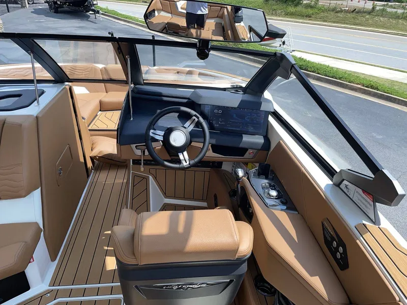 Slide: The Image of Interior of a 2026 Nautique G23 boat with modern cockpit. - 24