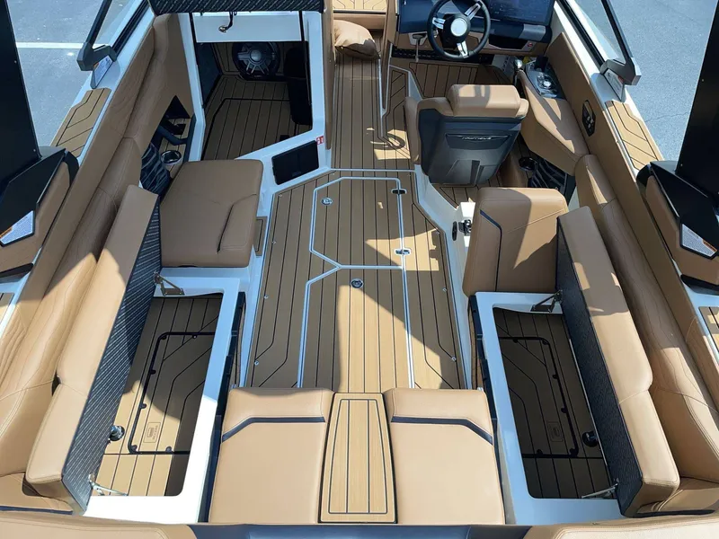 Slide: The Image of Interior of 2026 Nautique G23 featuring luxurious seating and modern design. - 27