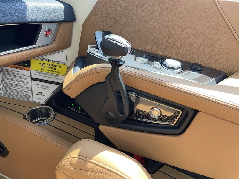 Slide: The Image of Interior of 2026 Nautique G23 with control console and controls. - 29