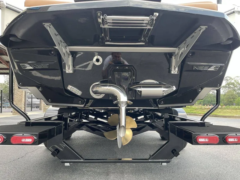 Slide: The Image of Rear view of 2026 Nautique G23 boat with propeller. - 31