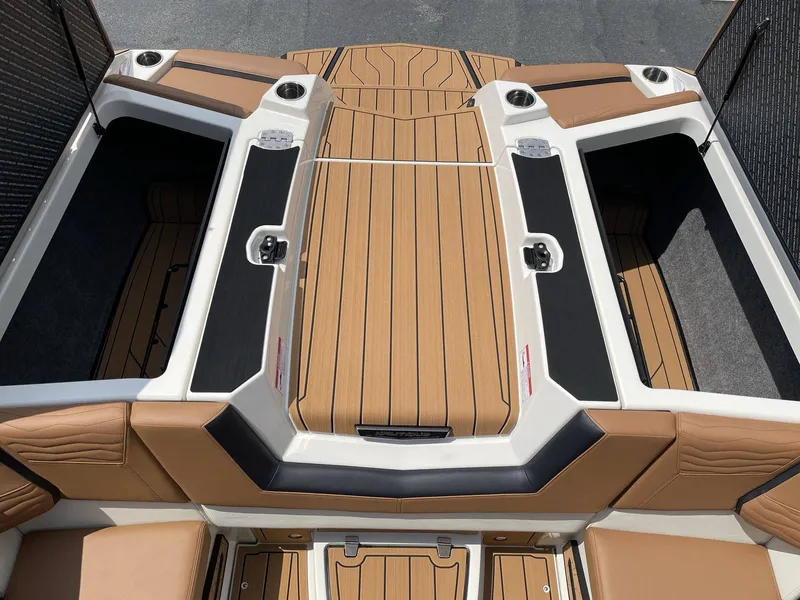 Slide: The Image of Interior of 2026 Nautique G23 featuring luxurious seating area. - 36
