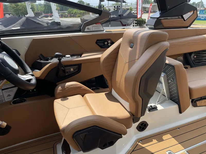 Slide: The Image of Interior of 2026 Nautique G23 featuring luxurious leather seating. - 40