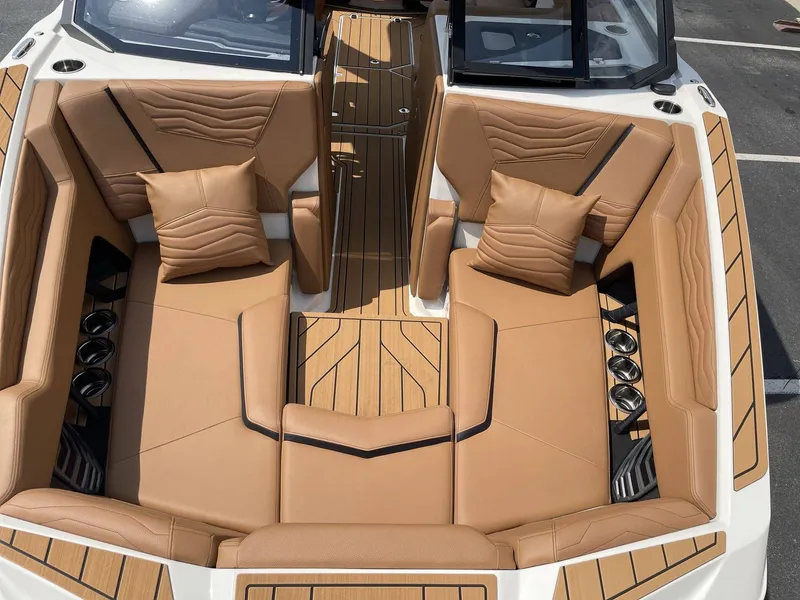 Slide: The Image of Luxurious interior of 2026 Nautique G23 with beige leather seating. - 42