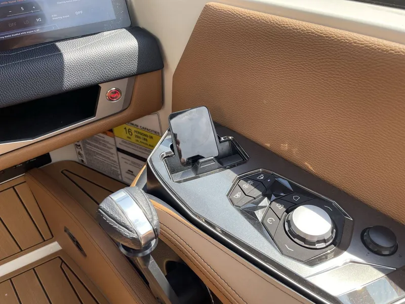 Slide: The Image of 2026 Nautique G23 interior with control console and dashboard features. - 45