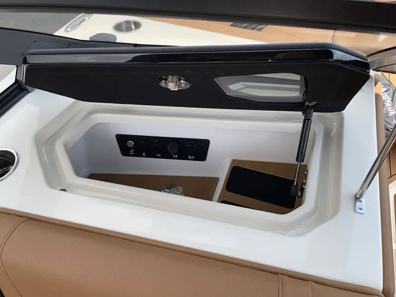 Slide: The Image of Interior view of 2026 Nautique G23 boat storage compartment. - 46
