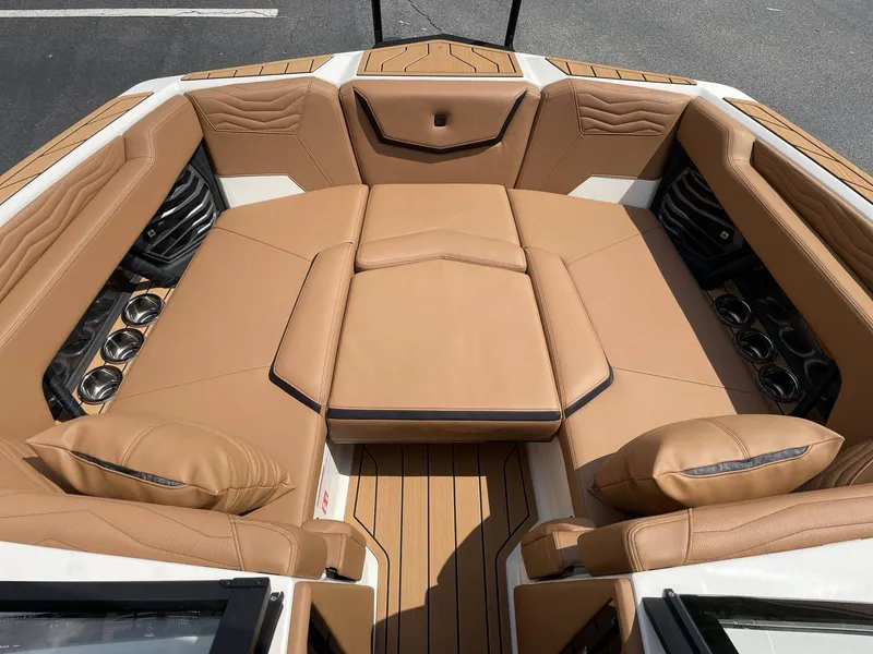 Slide: The Image of Luxurious interior of 2026 Nautique G23 with beige leather seating. - 49