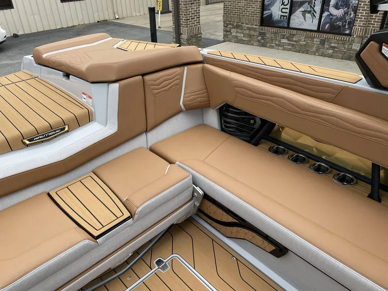 Slide: The Image of Interior of 2026 Nautique G25 with luxurious leather seating. - 10