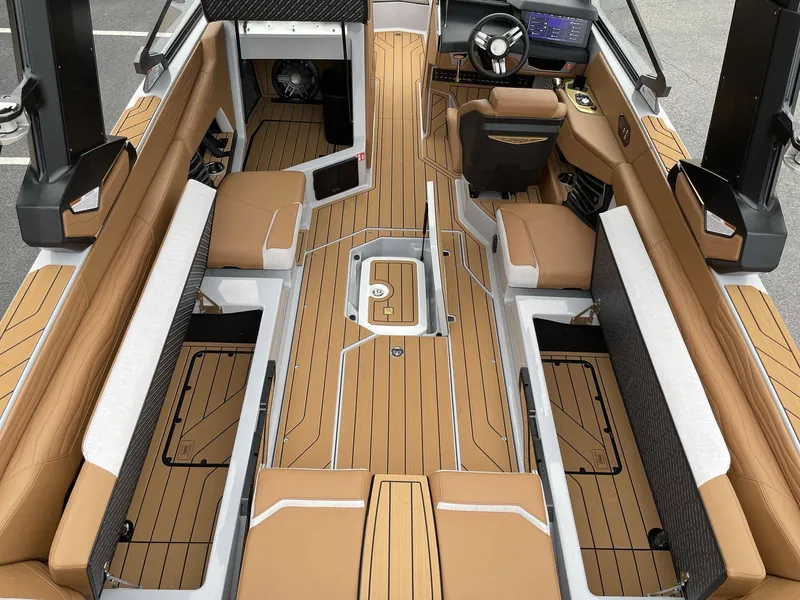 Slide: The Image of Interior of 2026 Nautique G25 boat with luxurious features. - 18