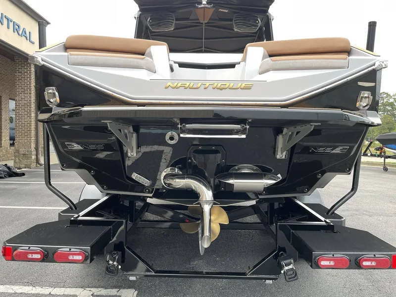 Slide: The Image of Rear view of a 2026 Nautique G25 boat on a trailer. - 19