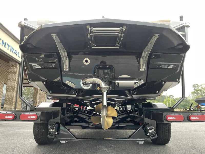 Slide: The Image of Rear view of a 2026 Nautique G25 boat on a trailer. - 21