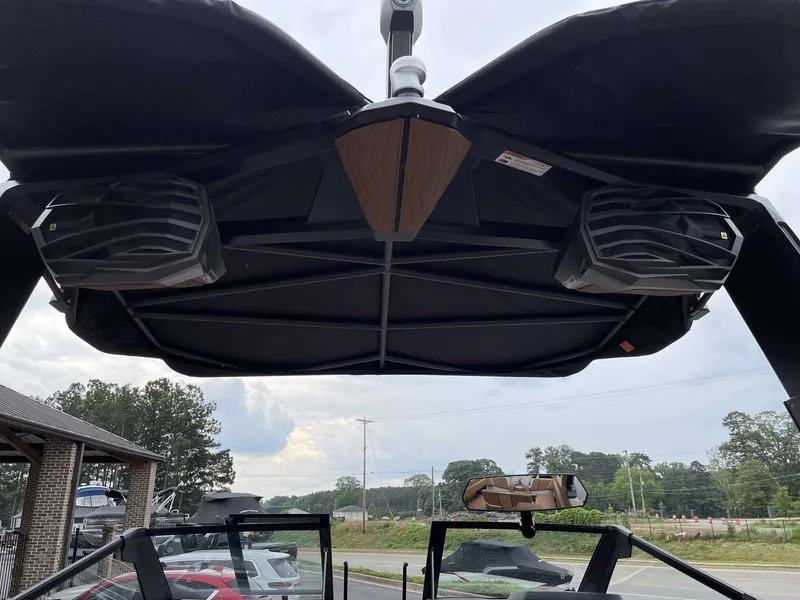 Slide: The Image of 2026 Nautique G25 boat with speakers and sunshade. - 24
