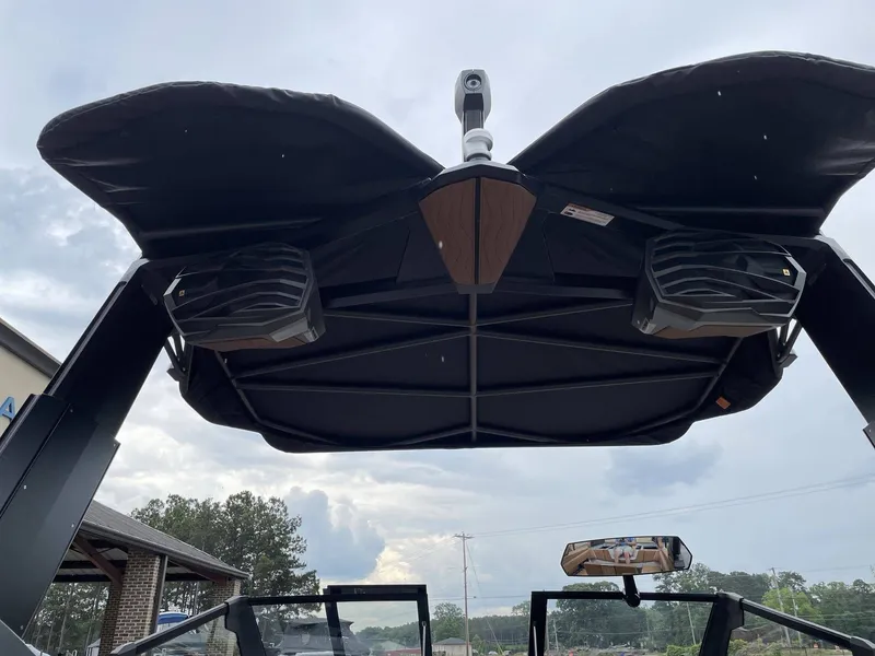 Slide: The Image of 2026 Nautique G25 boat with speakers and canopy. - 27