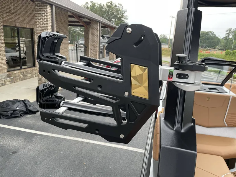 Slide: The Image of Nautique G25 2026 boat with advanced wakeboard rack. - 32