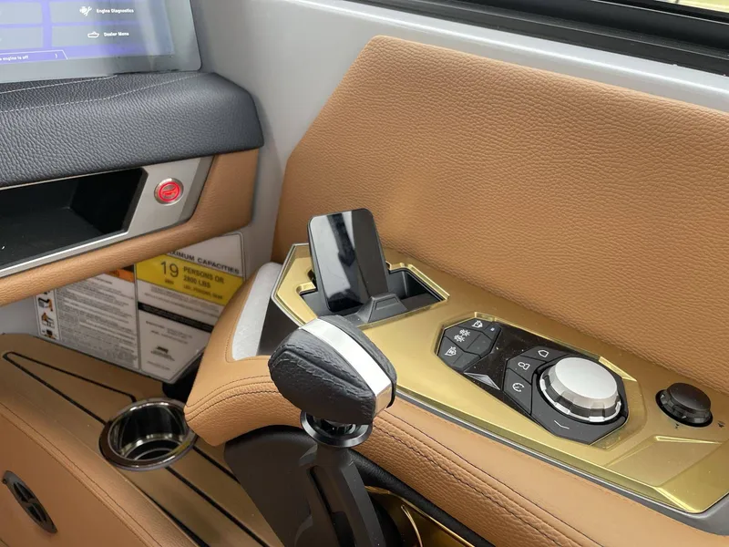 Slide: The Image of Interior of 2026 Nautique G25 with controls and display. - 36