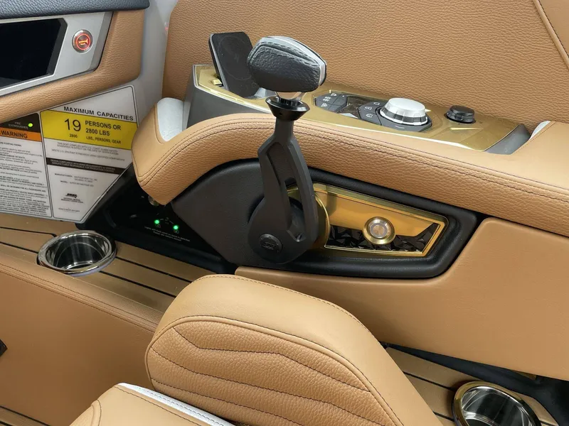 Slide: The Image of Interior of 2026 Nautique G25 with controls and leather upholstery. - 39