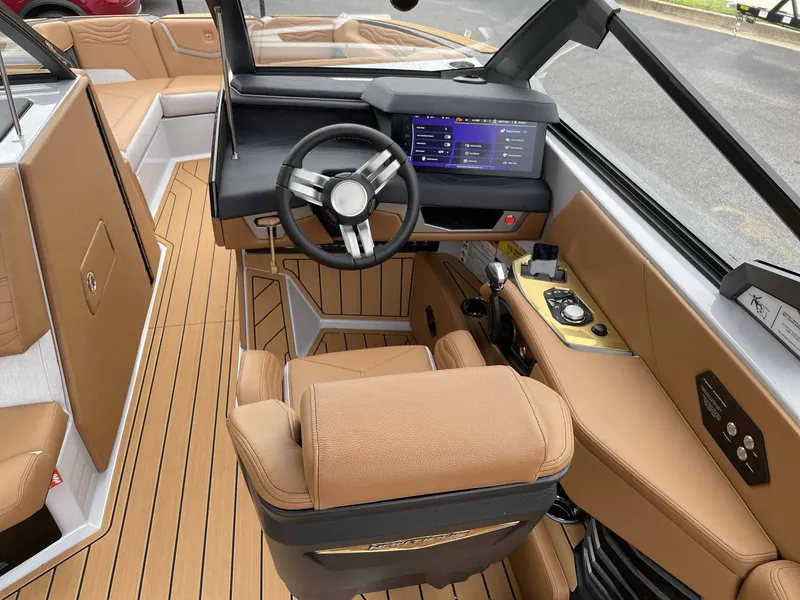 Slide: The Image of Interior of 2026 Nautique G25 with modern cockpit and leather seating. - 40