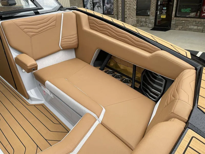 Slide: The Image of Interior of 2026 Nautique G25 featuring luxurious leather seating. - 5