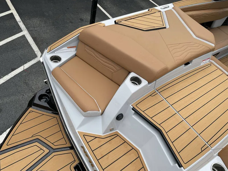 Slide: The Image of 2026 Nautique G25 boat with luxurious deck design. - 8