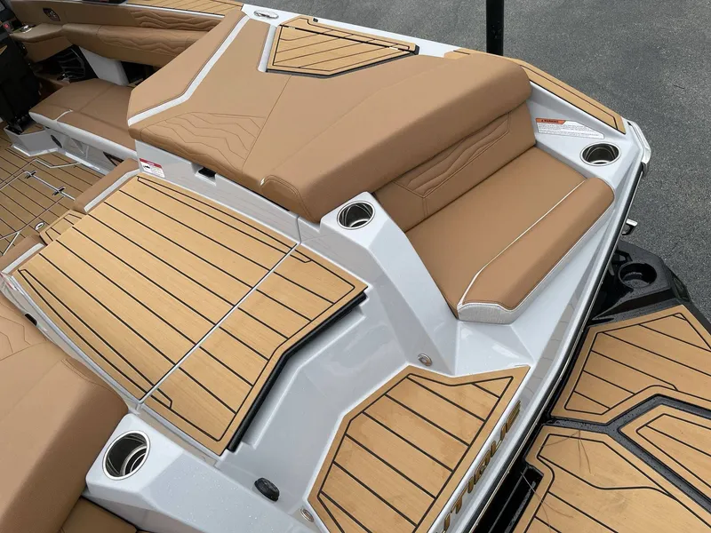 Slide: The Image of 2026 Nautique G25 boat with luxurious deck design. - 9