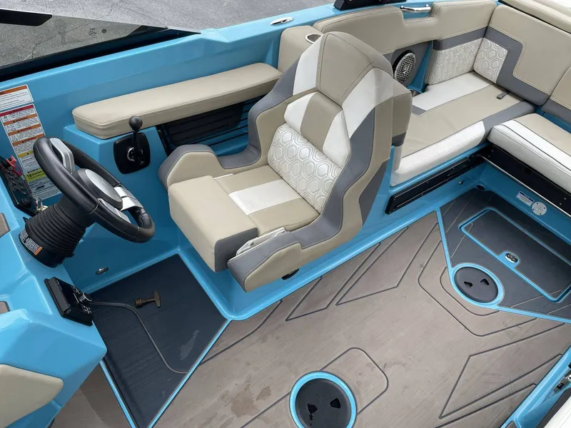 Slide: The Image of Interior of a 2022 HEYDAY WAKE BOATS H22 with blue accents. - 10