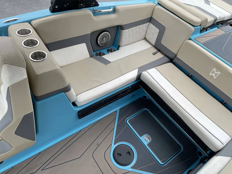 Slide: The Image of Interior of 2022 HEYDAY WAKE BOATS H22 with blue and beige seating. - 12