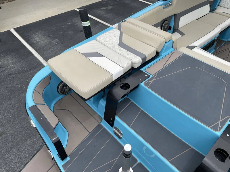 Slide: The Image of Interior of a 2022 HEYDAY WAKE BOATS H22 with blue and beige seating. - 13