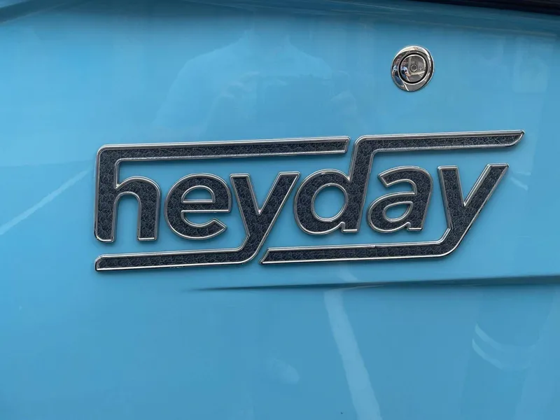 Slide: The Image of Heyday Wake Boats H22 2022 logo on blue background. - 15