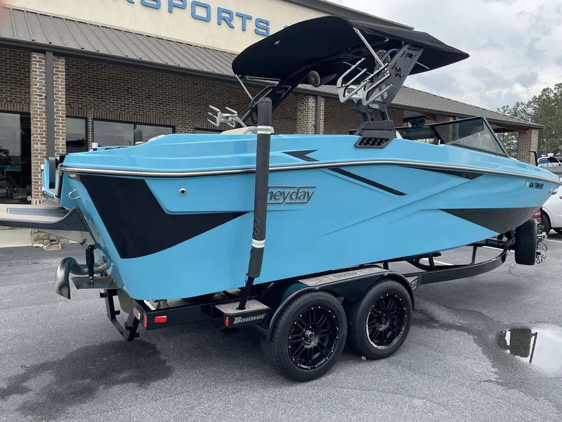 Slide: The Image of 2022 HEYDAY WAKE BOATS H22 in blue on trailer. - 21