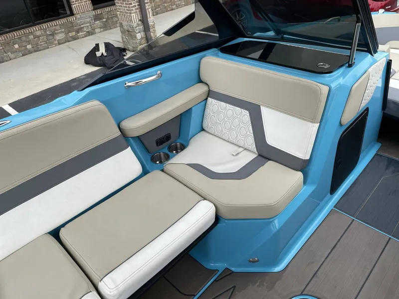 Slide: The Image of Interior of 2022 HEYDAY WAKE BOATS H22 with blue and beige seating. - 24