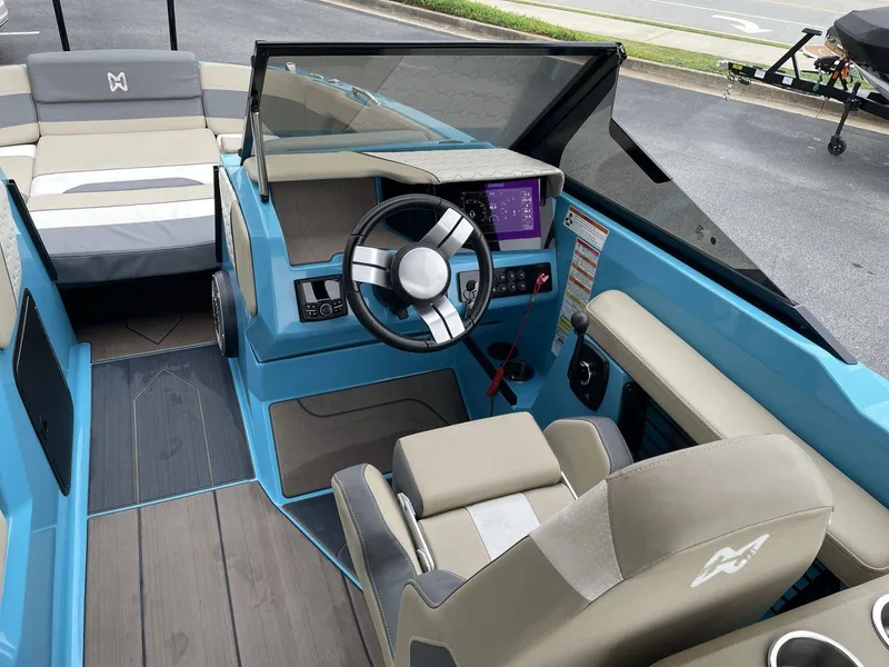 Slide: The Image of Interior of a 2022 HEYDAY WAKE BOATS H22 with blue dashboard. - 25